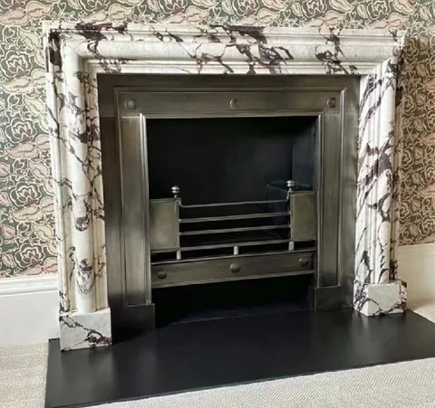 White Volakas marble fireplace surround, with strong pattern contrast