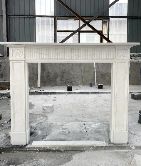 White Volakas marble fireplace surround, with fine veining, in a workshop