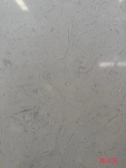 gray engineered stone slab, with cloudy mottling, shown from an overhead view with single main form