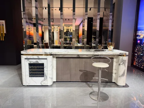 white stone countertop, with a single-level island and bold veining, in a showroom
