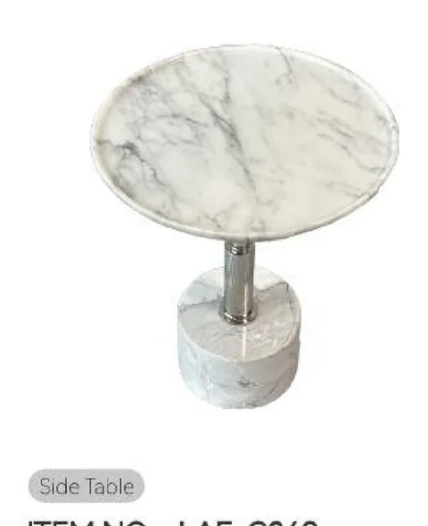 white stone side table, with a round top and fine veining, on a plain backdrop