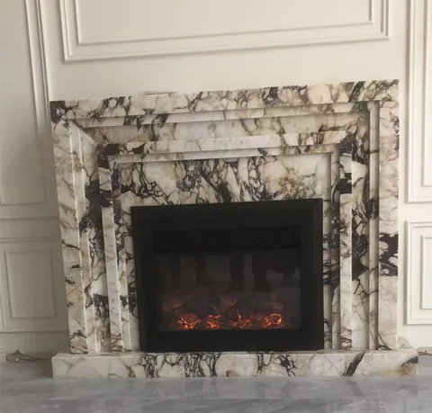 White Volakas marble fireplace surround, with bold veining, shown from a frontal view with strong pattern contrast
