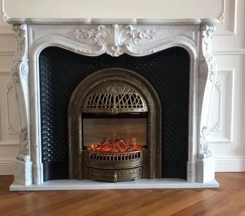 White Volakas marble fireplace surround, with fine veining, showing a single main form