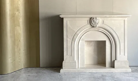White Volakas marble fireplace surround, with an uncluttered setting