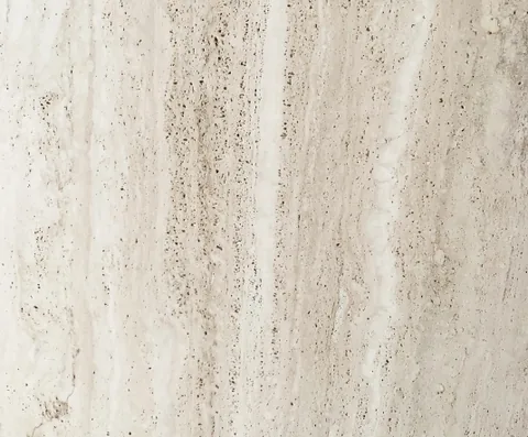 cream-beige stone slab, with linear travertine grain and a matte finish, in a close surface view