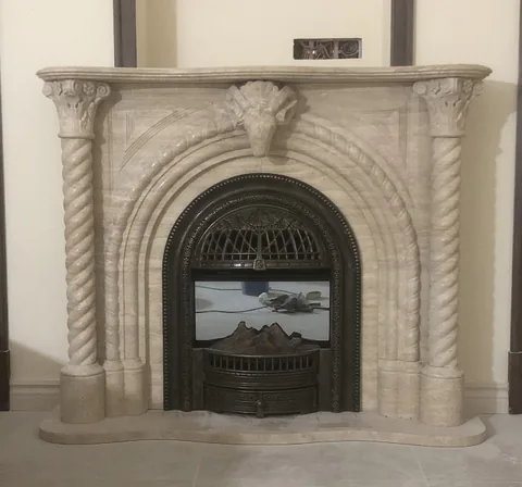 White Volakas marble fireplace surround, with subtle pattern contrast and an uncluttered setting