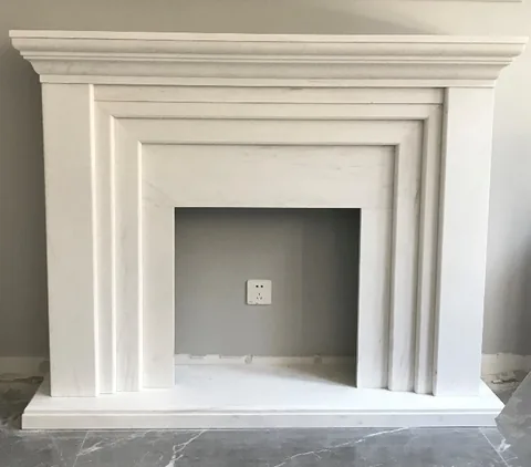 travertine fireplace surround, with stepped tiers and fine veining, in a workshop
