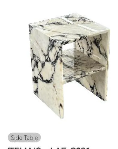 cream-beige stone side table, with bold veining and a reflective finish, on a plain backdrop