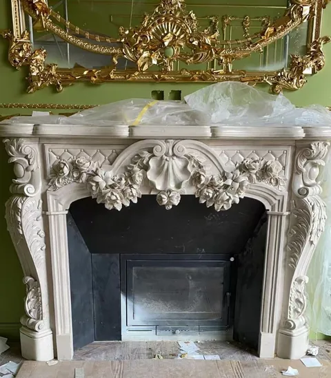 White Volakas marble fireplace surround, with a plain surface