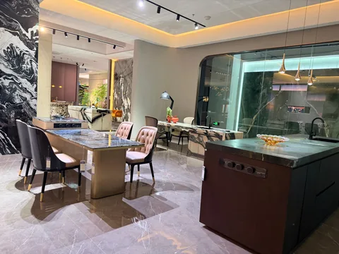 black stone countertop, with bold veining and a reflective finish, in a showroom