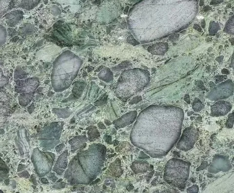 green stone slab, with a single full slab and angular breccia fragments, in a close surface view