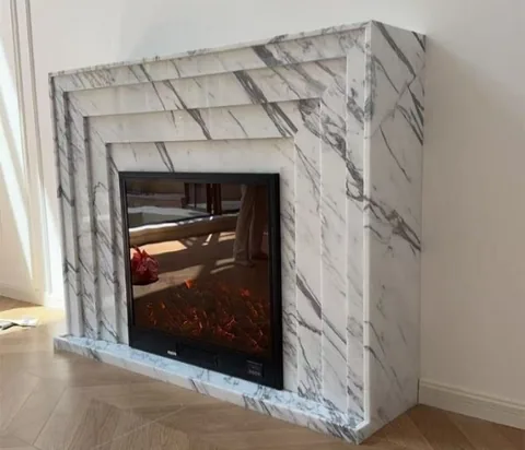 Arabescato Corchia marble fireplace surround, showing a single main form
