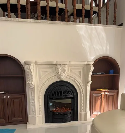 White Volakas marble fireplace surround, with plain surface, showing a single main form