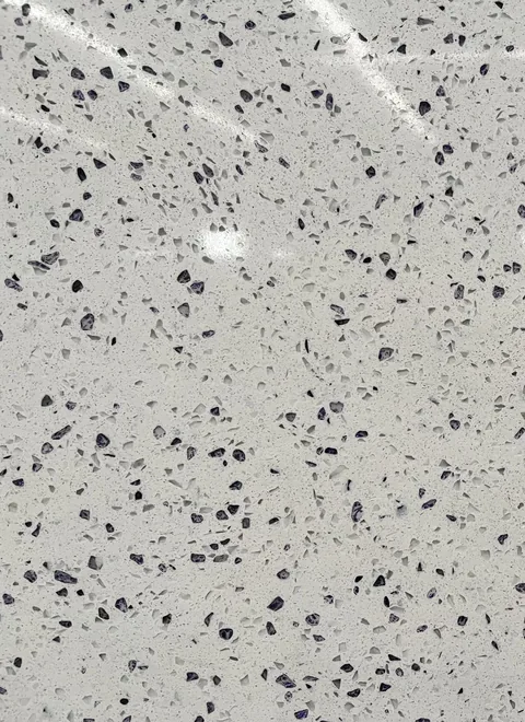 white engineered stone slab, shown from an overhead view with an uncluttered setting