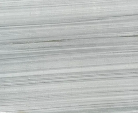 gray stone slab, with banded onyx-like striping, in a close surface view