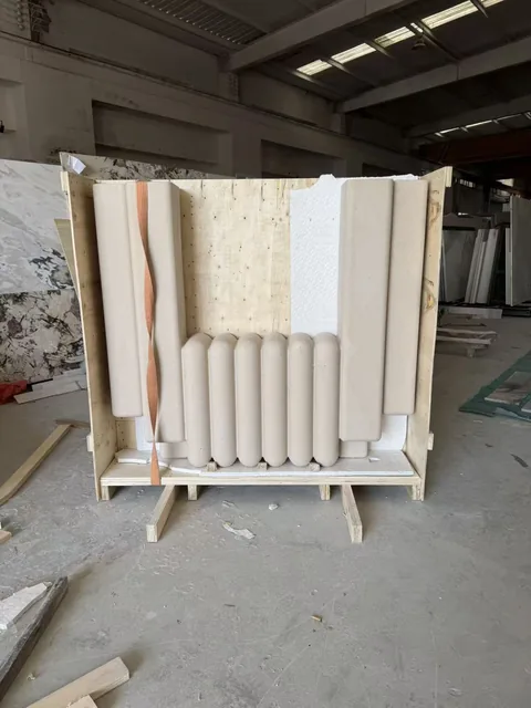 cream-beige stone fireplace surround, with a plain surface, in protective packing