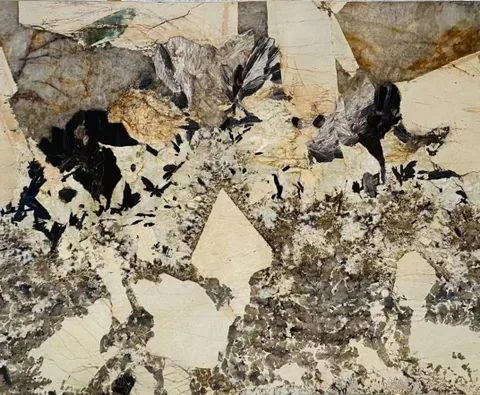 cream-beige stone slab, with a single full slab and angular breccia fragments, in a close surface view