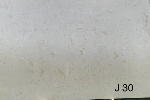 cream-beige engineered stone slab, with cloudy mottling, shown from a frontal view with an uncluttered setting