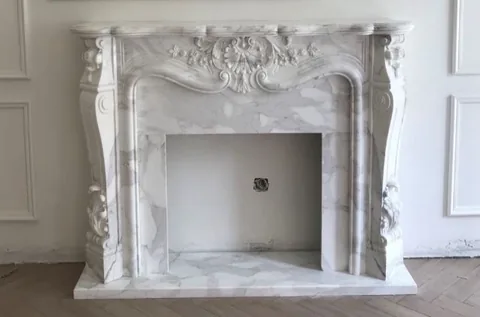 White Volakas marble fireplace surround, shown from a frontal view with single main form