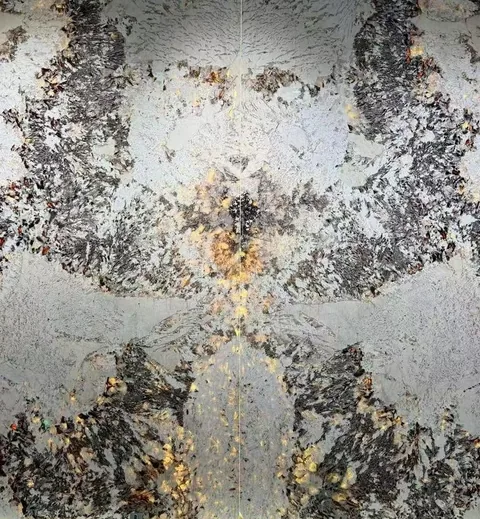 gray stone slab, with a bookmatched slab pair and cloudy mottling, in a close surface view