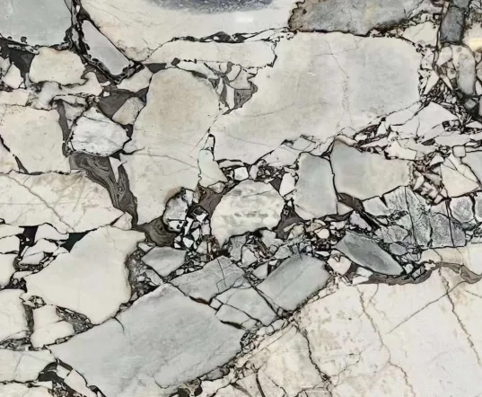white stone slab, with angular breccia fragments, in a close surface view