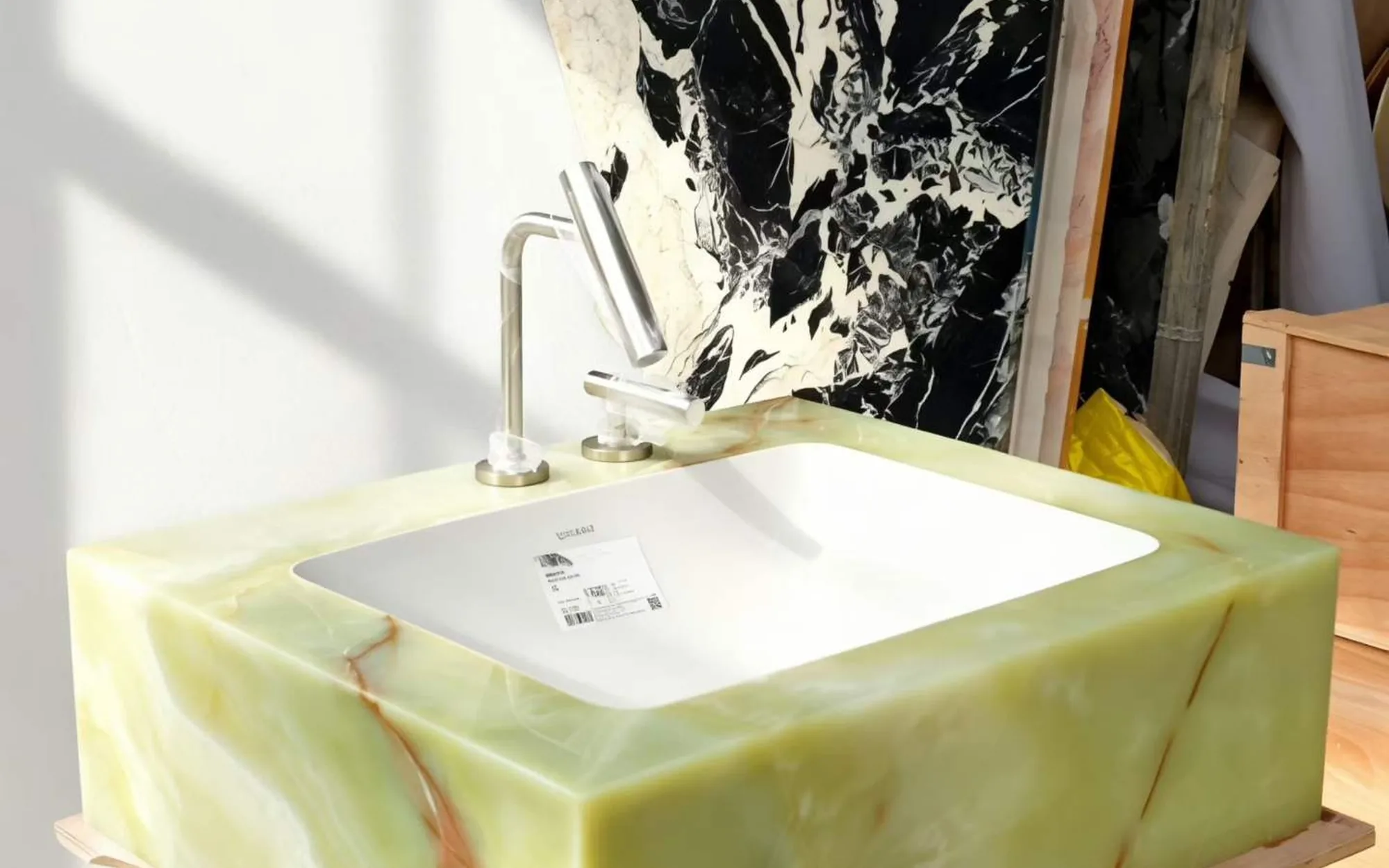 Green stone sink basin with a polished counter and faucet