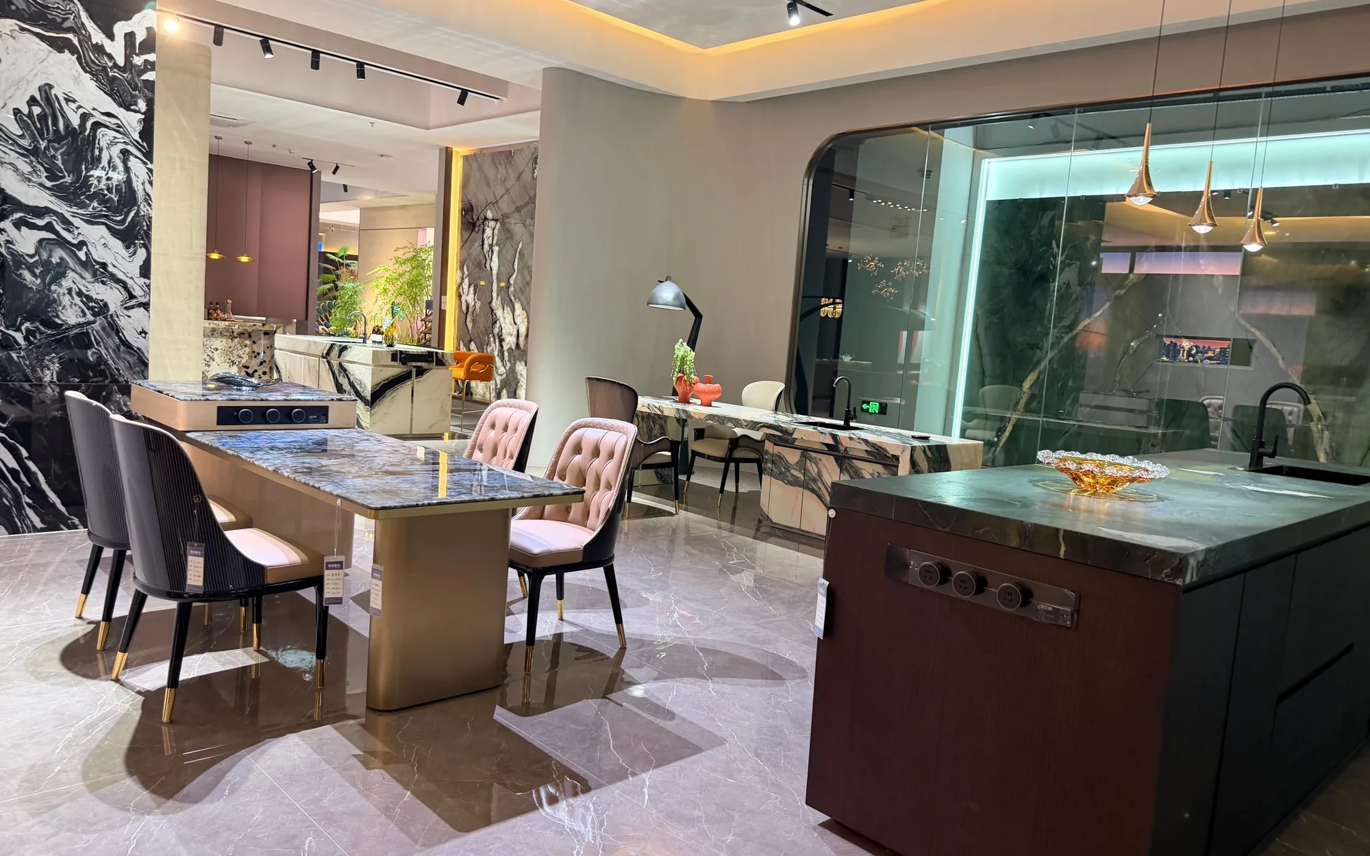 Stone dining table and kitchen island in a warm residential interior