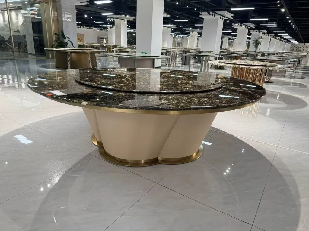 black stone dining table, with a speckled texture and a reflective finish, in a showroom