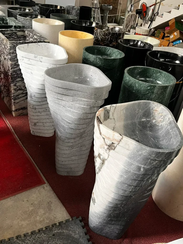 gray stone sink, with bold veining, in a workshop