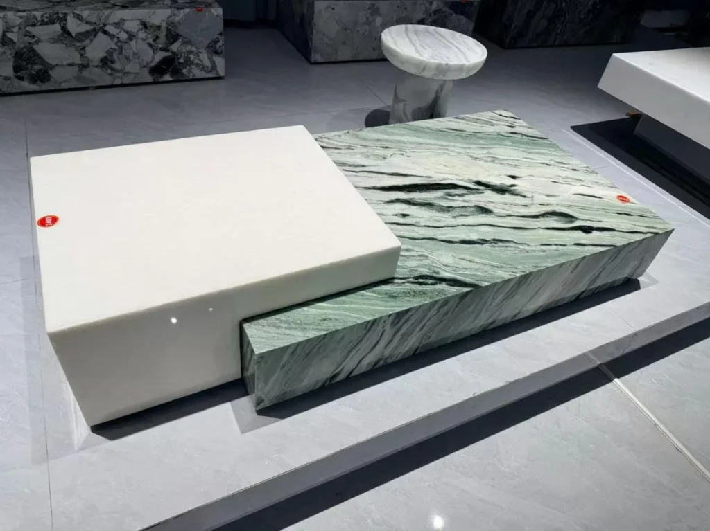 green stone coffee table, with bold veining and a reflective finish, in a showroom