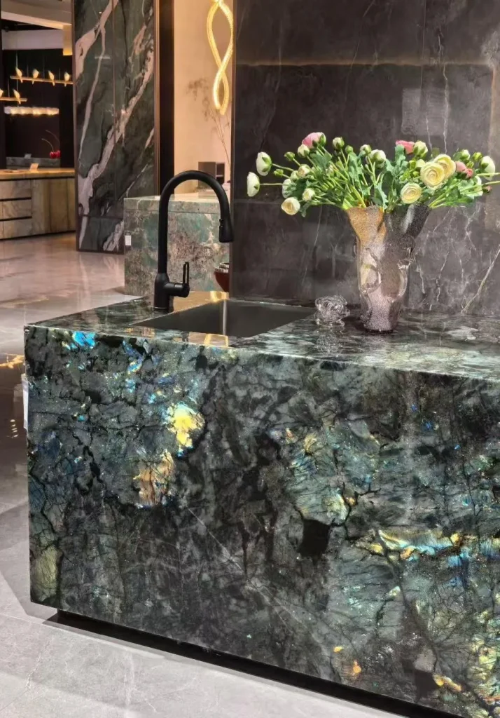 green stone countertop, with a crystalline texture and a reflective finish, in a showroom