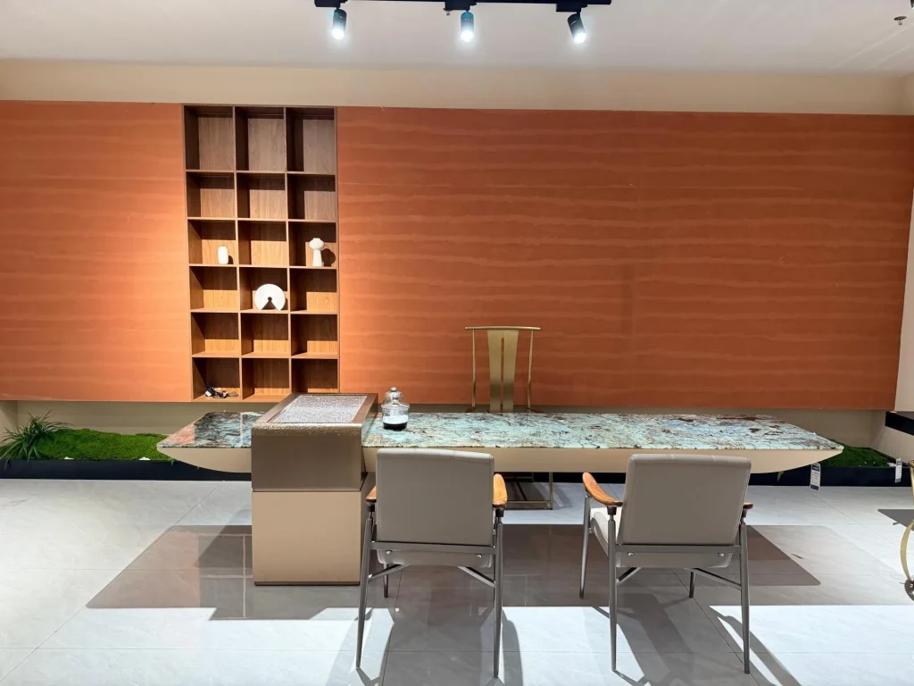 green stone dining table, with a crystalline texture and a reflective finish, in a showroom