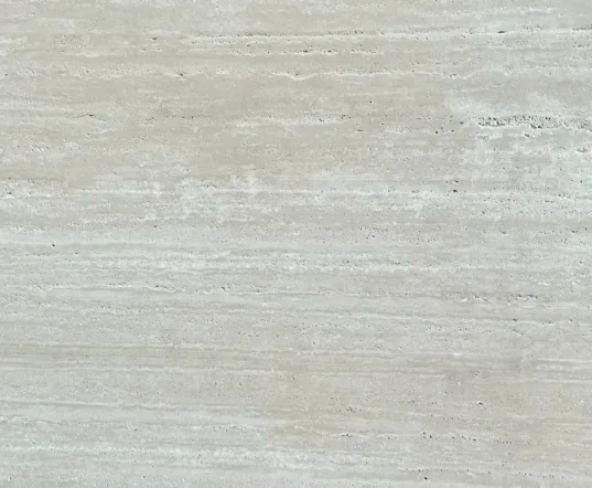 cream-beige stone slab, with linear travertine grain and a matte finish, in a close surface view