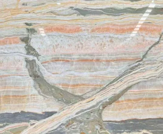 cream-beige stone slab, with banded onyx-like striping and a reflective finish, in a close surface view