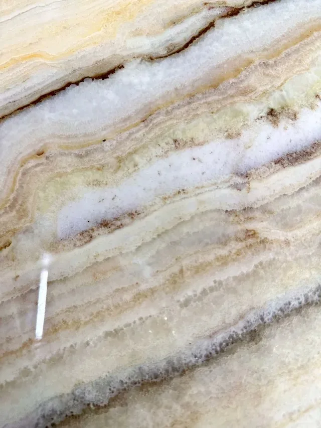 Multicolor onyx slab with banded veining