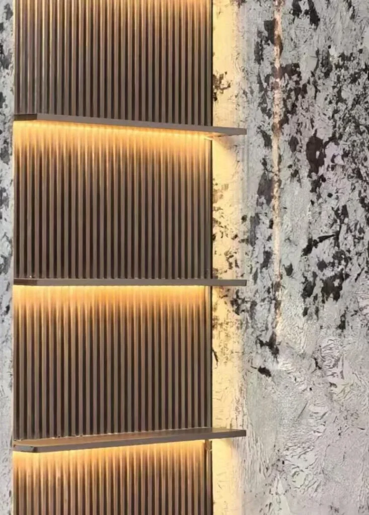 white stone wall feature, with cloudy mottling and a textured finish