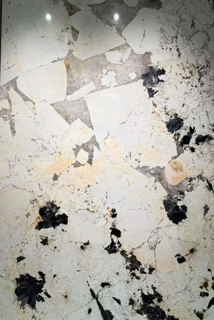 white stone slab, with a single full slab and angular breccia fragments, in a close surface view