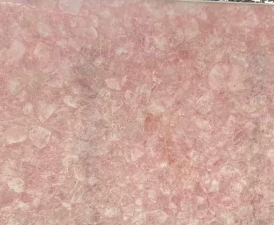 rose-red stone slab, with a single full slab and angular breccia fragments, in a close surface view