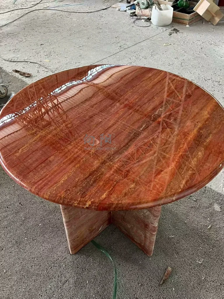 Red travertine dining table with linear veining