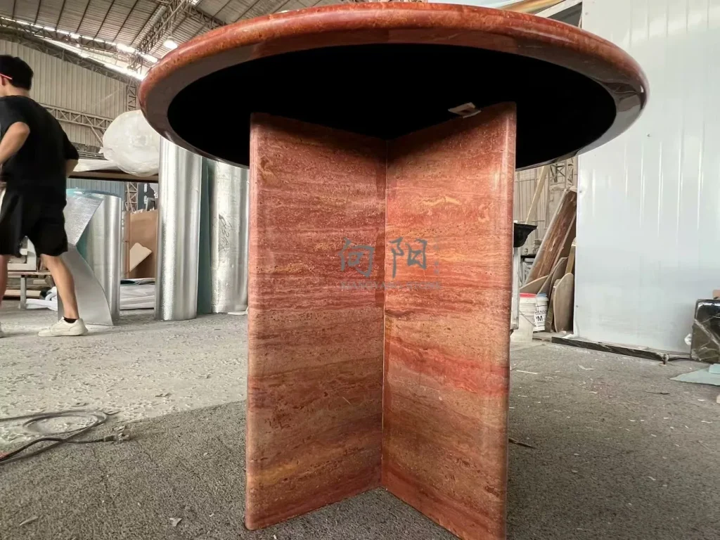 Red travertine dining table with linear veining