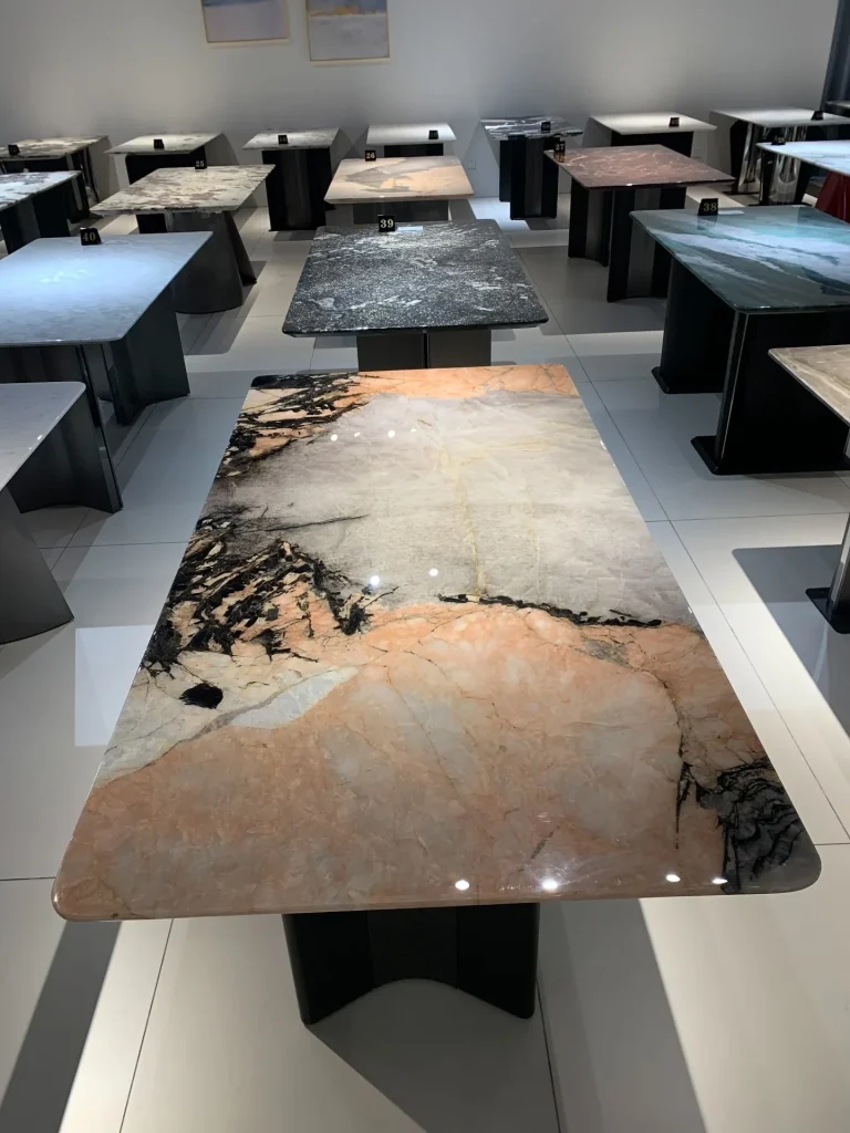 Smoke pink stone dining table with cloudy veining