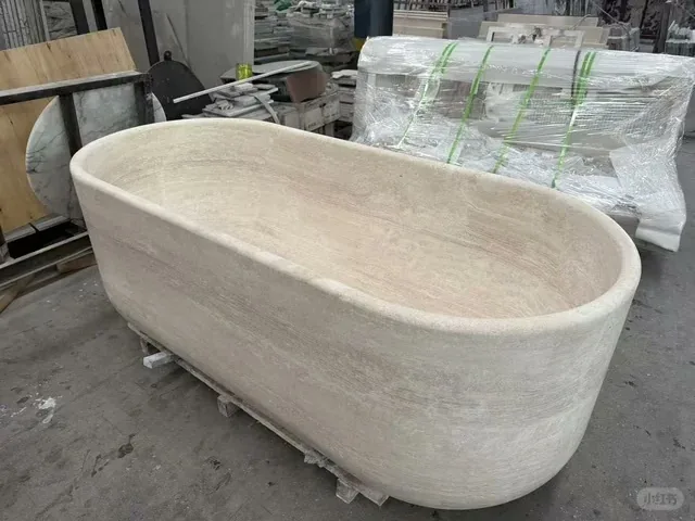 White travertine bathtub with linear veining