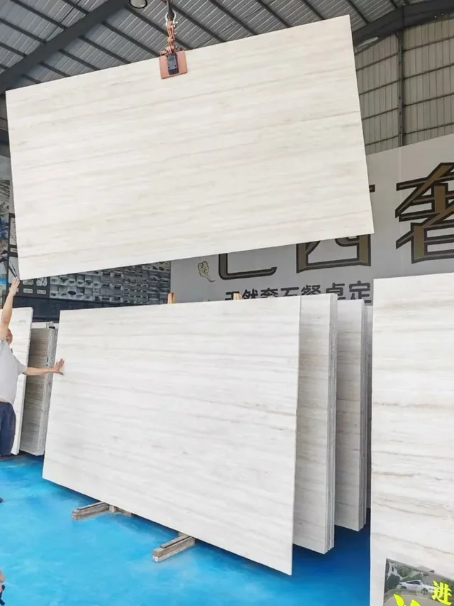 White travertine slab with linear veining