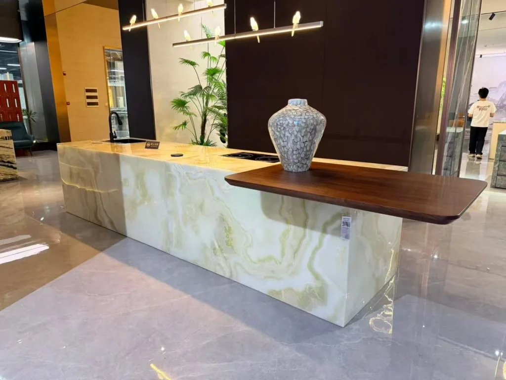 white stone countertop, with banded onyx-like striping and a reflective finish, in a showroom