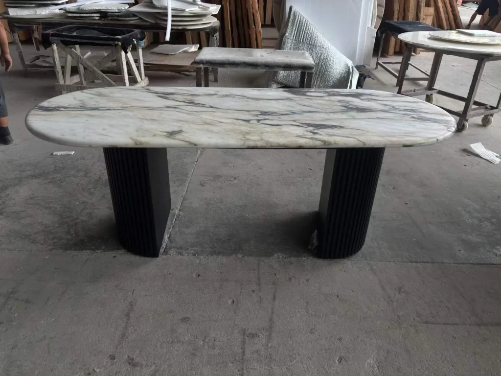 white stone dining table, with workshop equipment nearby