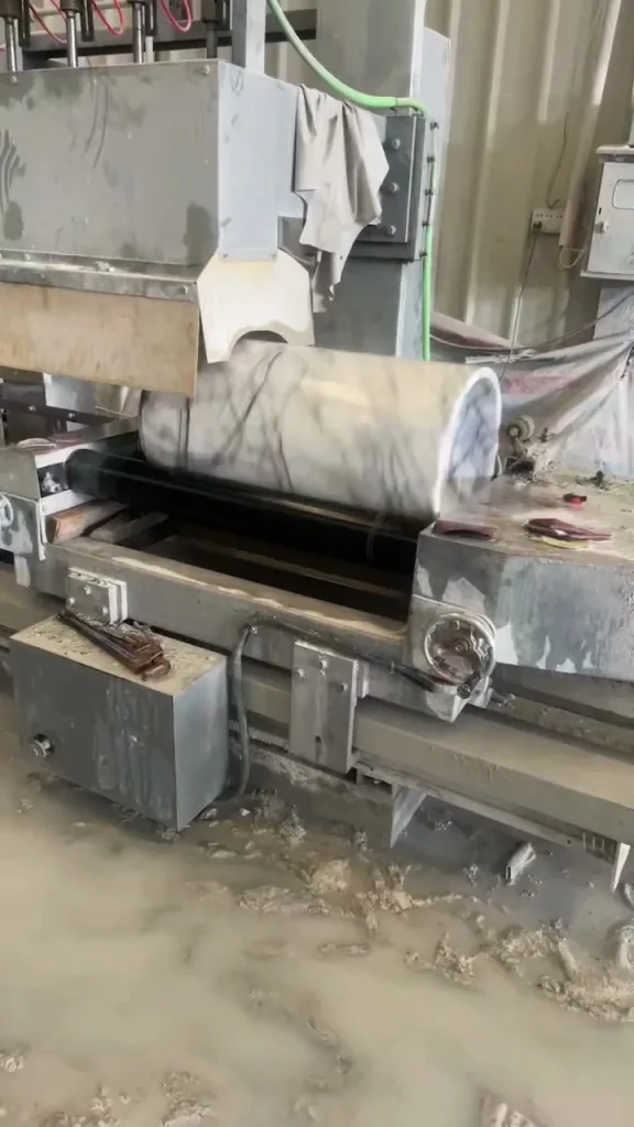 white stone slab, with a single full slab and fine veining, in a workshop